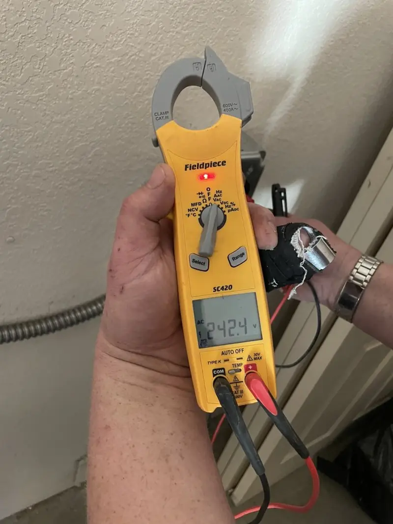 Voltage testing with clamp meter during Electrical Installation Services in Wyandotte